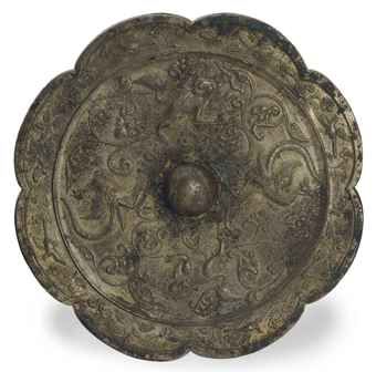 a_large_chinese_bronze_lobed_mirror_cast_with_phoenix_and_buddhistic_l_d5453845h