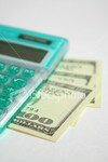 ist2_1449264_green_calculator_with_dollars_2