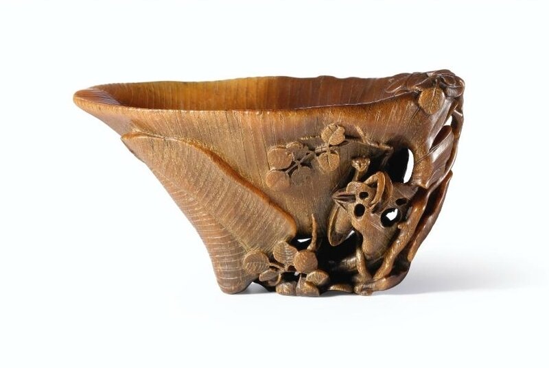 A Carved Rhinoceros Horn 'Plantain' Cup by You Kan, Qing Dynasty, Kangxi Period (1662-1722)