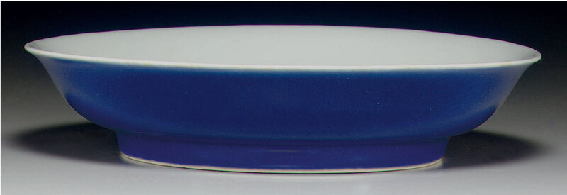 A very rare imperial blue-glazed anhua-decorated shallow dish, Xuande six-character incised mark within a double circle and of the period (1426-1435) (3)