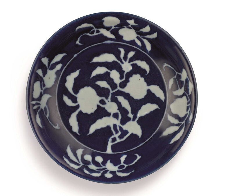 AN EXCEPTIONALLY RARE AND IMPORTANT BLUE AND WHITE REVERSE-DECORATED ‘POMEGRANATE’ DISH, MARK AND PERIOD OF XUANDE