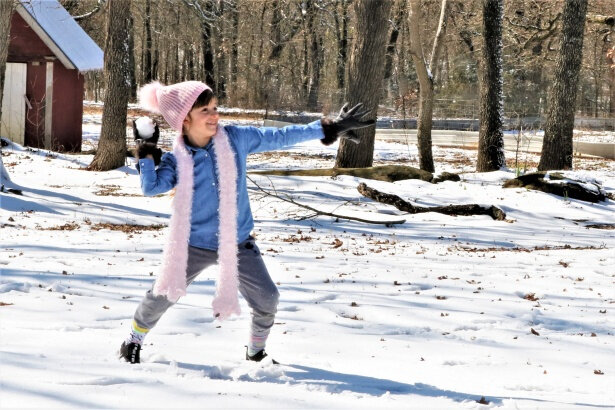 little-girl-throwing-snowball