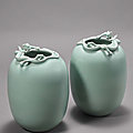 A fine and very rare pair of celadon-glazed <b>ovoid</b> <b>vases</b> with chilong appliques, Qianlong six-character seal marks and of the per