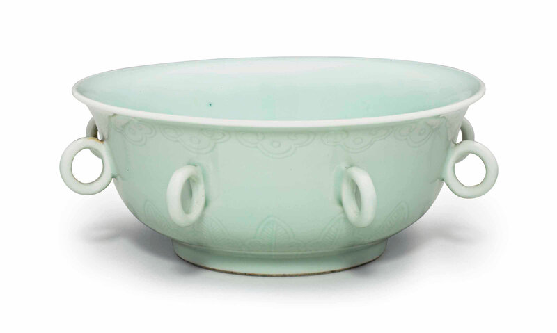 An unusual celadon-glazed incised bowl with loop handles, Qianlong six-character mark in underglaze blue and of the period (1736