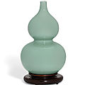A fine celadon-glazed '<b>double</b> <b>gourd</b>' <b>vase</b>, Jiaqing six-character seal mark in underglaze blue and of the period (1796-1820)