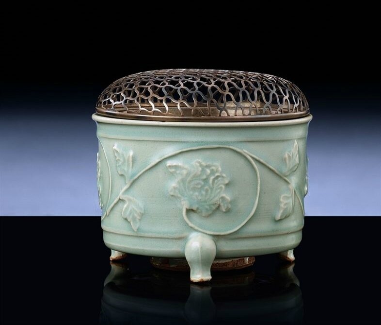 A Longquan celadon relief-decorated tripod censer, Southern Song-Yuan dynasty, 13th-14th century