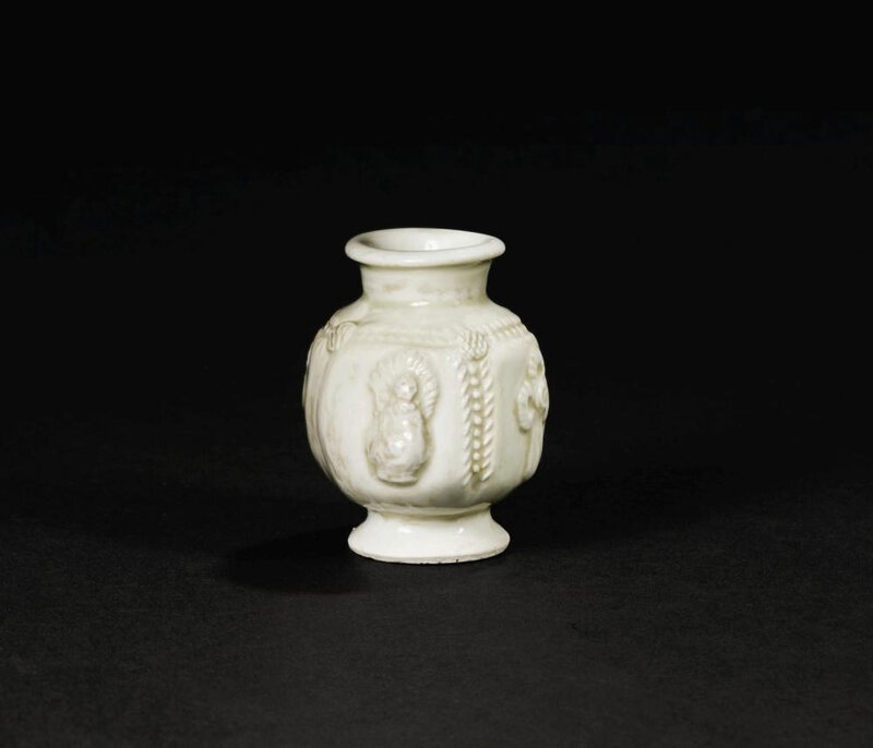 A small white-glazed 'Buddha' lantern vase, Five Dynasties, 10th century