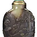 A carved yellowish-green and brown jade snuff bottle, Master of the Rocks School, <b>1740</b>-<b>1850</b>