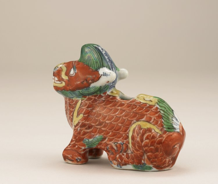 Incense-stick holder, Ming dynasty, Wanli mark and period, AD1573–1620. Porcelain with underglaze cobalt-blue, and overglaze red, green and yellow decoration, Jingdezhen, Jiangxi province. Height: 9 cm. Sir Percival David Foundation, PDF 713. © The Trustee