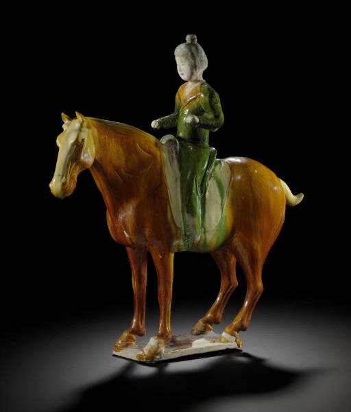 A sancai-glazed pottery figure of a horse and rider, Tang dynasty (618-907)