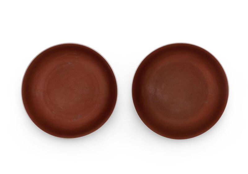 A fine pair of copper-red-glazed saucer dishes, Qianlong six-character marks and of the period (1736-1795)