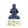 A finely carved and rare lapis lazuli figure of Amitabha Buddha on a white jade lotus stand, <b>Qing</b> dynasty, Qianlong period