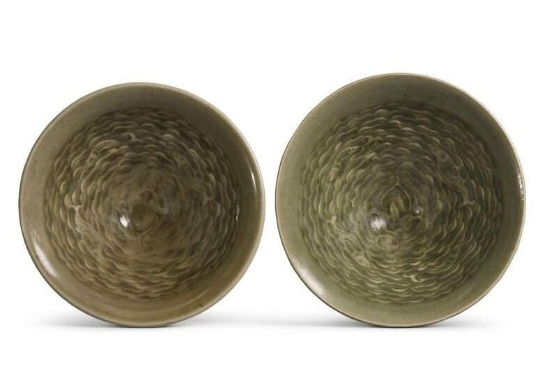 Two small molded 'Yaozhou' celadon-glazed 'fish' bowls, Northern Song-Jin dynasty