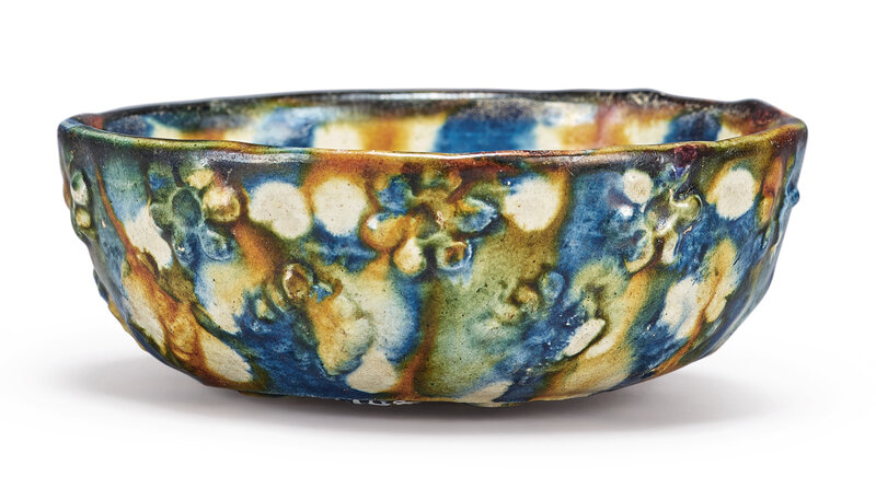 A molded sancai and blue-glazed cup, Tang dynasty (618-907)