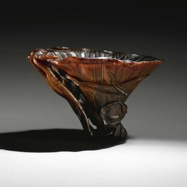 A finely carved rhinoceros horn libation cup, 17th century