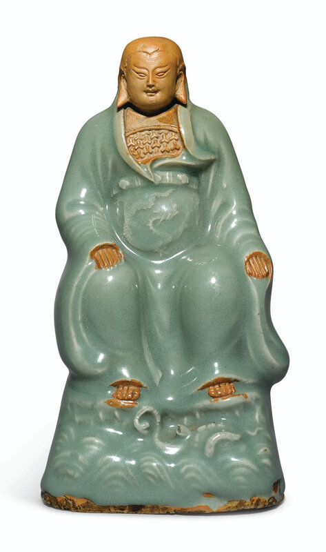 A celadon-glazed and biscuit figure of Zhenwu, Ming dynasty