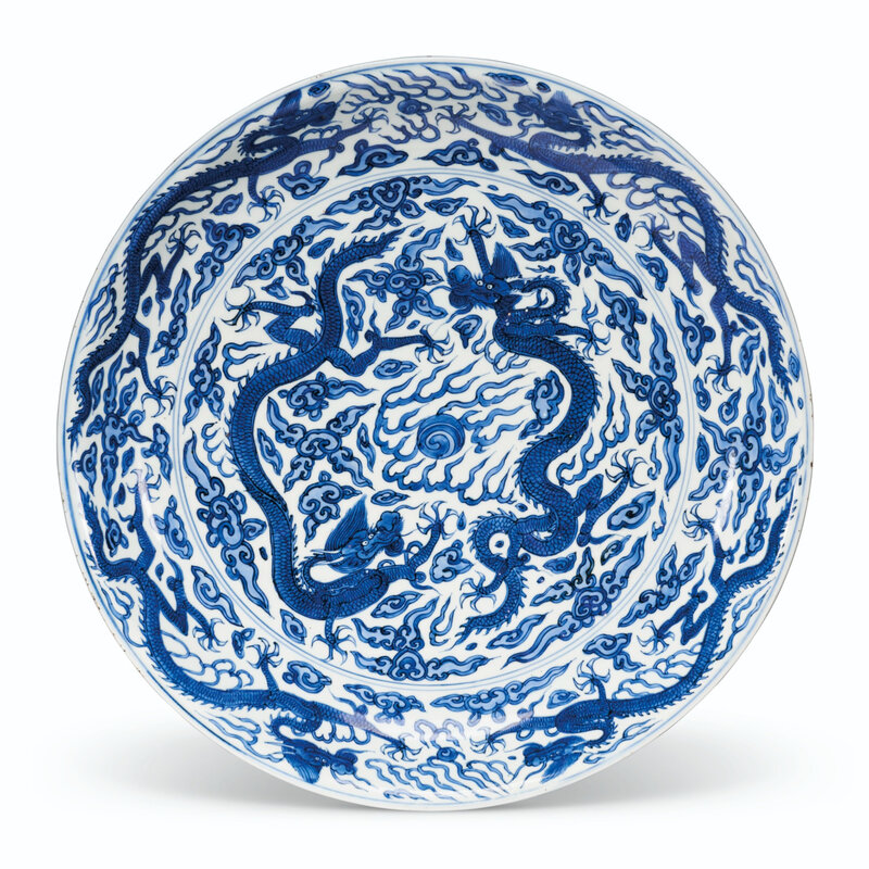 A large blue and white 'dragon' dish, Wanli six-character mark in underglaze blue within a double circle and of the period (1573-1619)