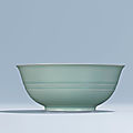 A fine and very rare <b>celadon</b>-<b>glazed</b> <b>bowl</b>, Yongzheng six-character mark within double circles and of the period 