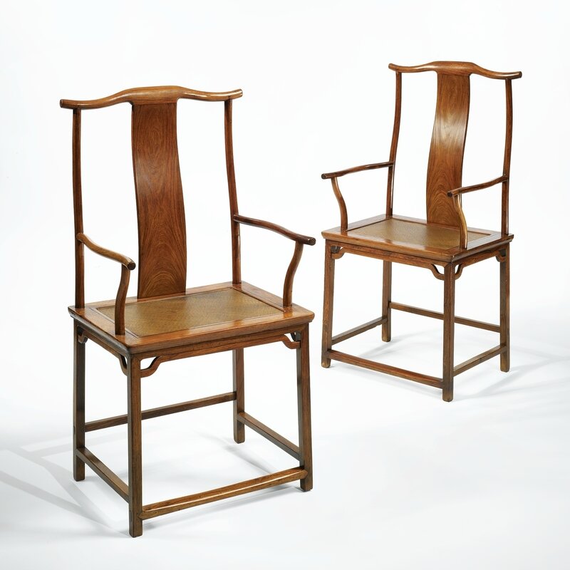 A fine pair of 'huanghuali' yokeback armchairs (guangmao yi), Qing dynasty, Kangxi period (1662-1722)