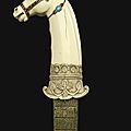A Mughal <b>gem</b>-<b>set</b> <b>ivory</b> horse head-hilted dagger, India, 17th century