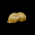 A small <b>yellow</b> <b>jade</b> figure of a rabbit, Song dynasty or earlier