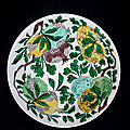A biscuit-<b>enamelled</b> incised 'dragon and sanduo' dish, Kangxi period (1662-1722)
