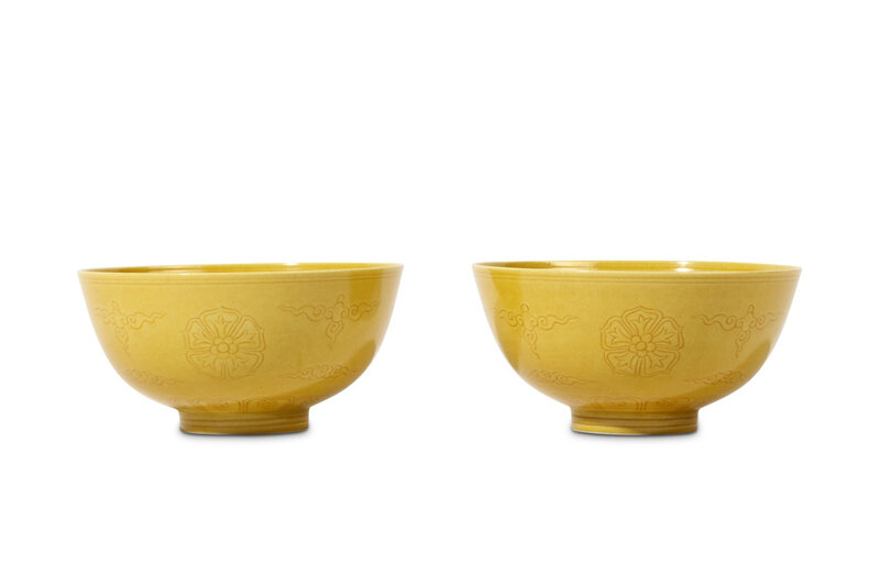 A pair of Chinese incised yellow-glazed bowls, Qing Dynasty, Qianlong mark and of the period (1736-1795)