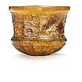A Roman amber glass cup signed by Ennion, circa first half of the 1st century A.D.