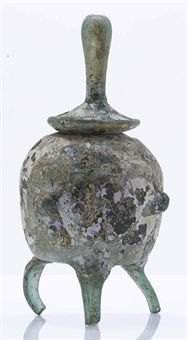 a_very_rare_iridescent_pale_green_glass_tripod_reliquary_jar_and_cover_d5379583h