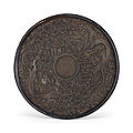 A rare carved black lacquer circular dish, Ming dynasty (1368-1644)