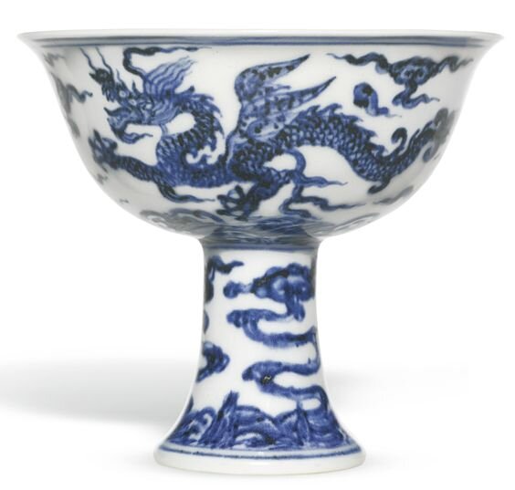 A rare and important blue and white ‘winged dragon’ stemcup, Mark and period of Xuande