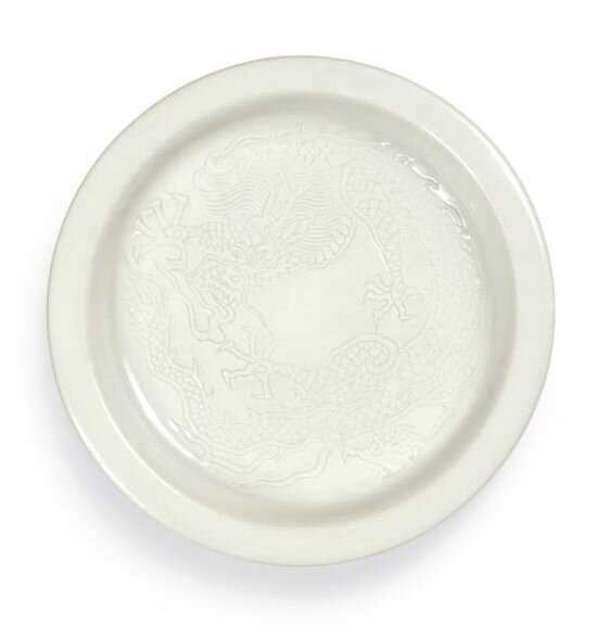 A rare white-glazed incised 'dragon' dish, late Ming–early Qing dynasty