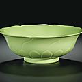 A fine and very rare <b>lime</b>-<b>green</b> <b>glazed</b> molded 'mallow-flower' bowl, Yongzheng mark and period (1723-1735)