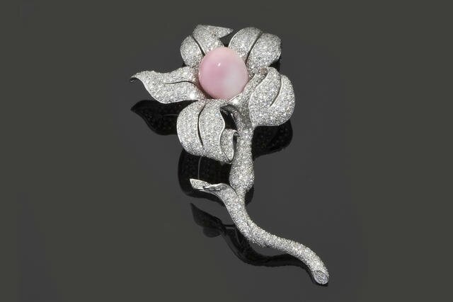 A diamond and conch pearl brooch