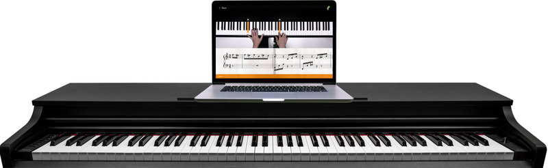 Laptop on piano
