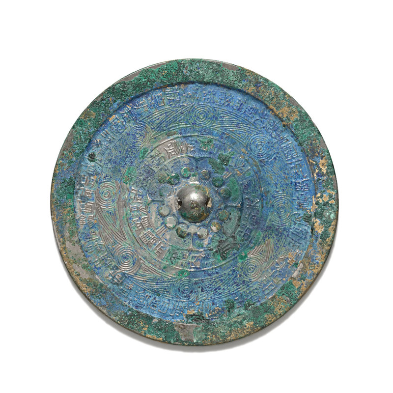 A brightly patinated bronze mirror, Han dynasty