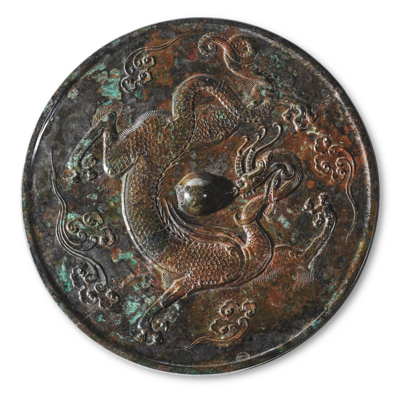 A rare silvery bronze 'dragon' mirror, Tang dynasty (618-907)