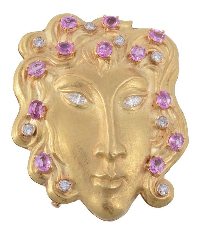 A pink sapphire and diamond mask brooch by Rinaldi