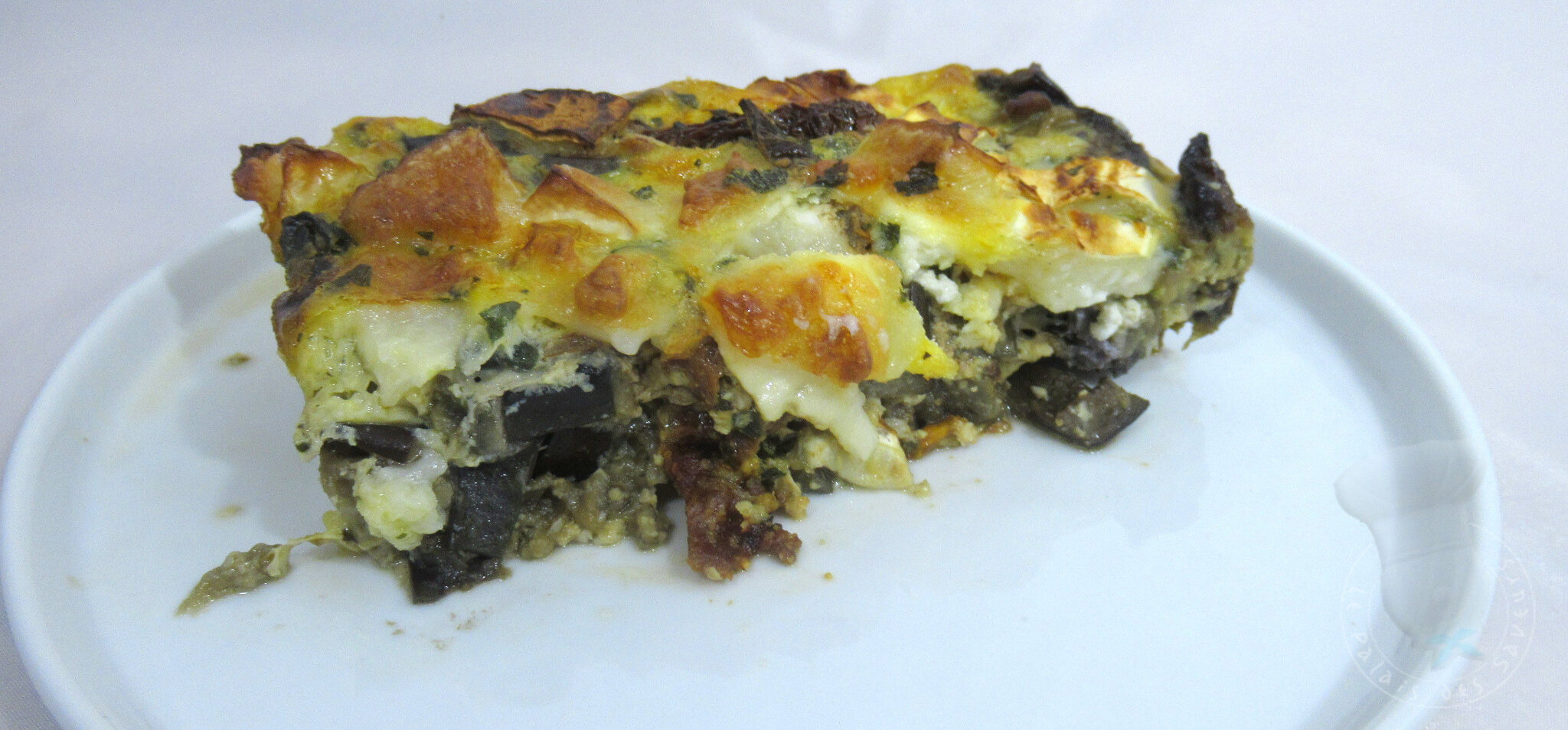 Clafoutis aubergine, tomate confite, chèvre