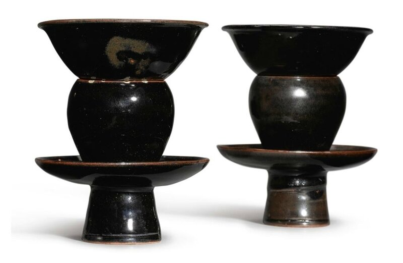 A pair of small black-glazed bowls and stands, Northern Song-Jin Dynasty