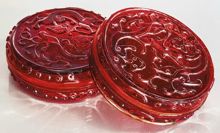 A rare pair of transparent red glass 'chilong' boxes and covers, Qing dynasty, 18th century