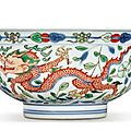 A fine wucai 'dragon and <b>phoenix</b>' <b>bowl</b>, Kangxi mark and period (1662-1722)