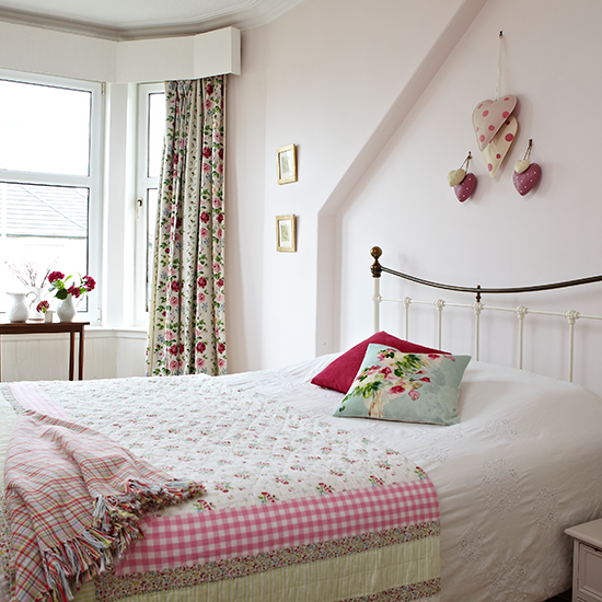 Pale-pink-bedroom-with-floral-accents-Style-at-Home-Housetohome