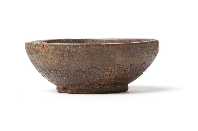 A rare small rhinoceros horn documentary 'vishnu' bowl, Nepal, dated by inscription to 1678 and of the period
