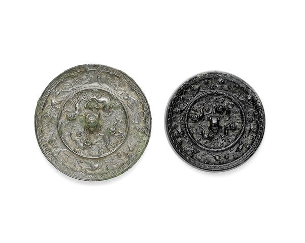 Two bronze 'lion and grapevine' mirrors, Tang Dynasty