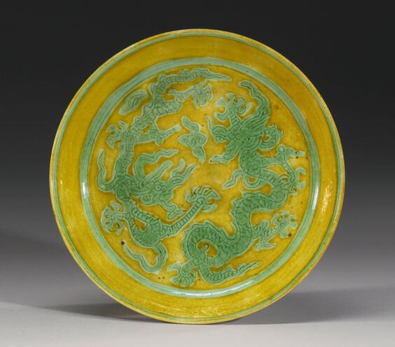 A yellow-ground green-enameled 'Dragon' dish, Jiajing mark and period (1522-1566)