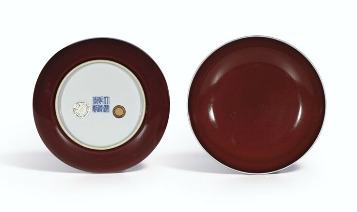 A fine pair of copper-red glazed dishes, Seal marks and period of Qianlong