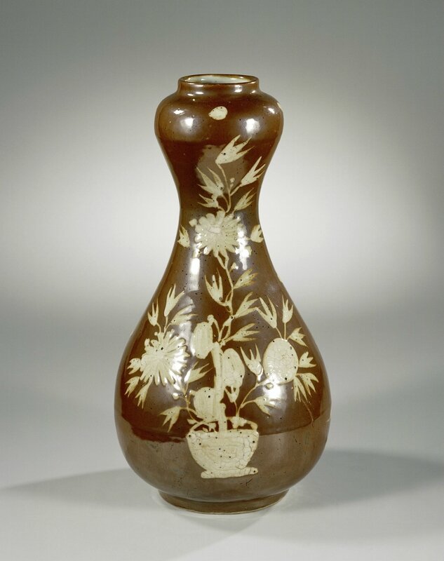 Vase with flowers in white on a brown glaze, Wanli period, c