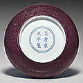 A small aubergine-glazed <b>incised</b> <b>dish</b>, Yongzheng six-character mark in underglaze blue within a double circle and of the period 