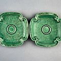 A very rare green-enamelled moulded and incised cupstand, Kangxi six-character mark and of the period (1662-1722) 